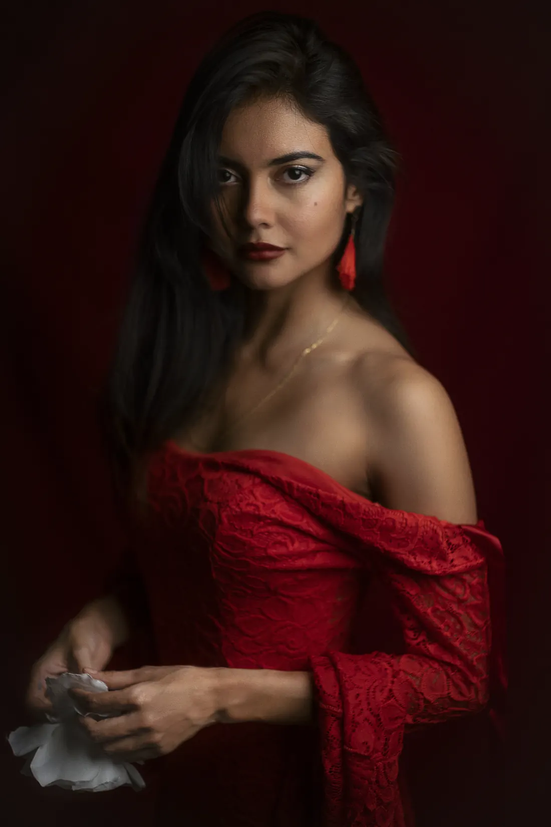 A flamenco dancer (bailaora) performing with expressive raised arms